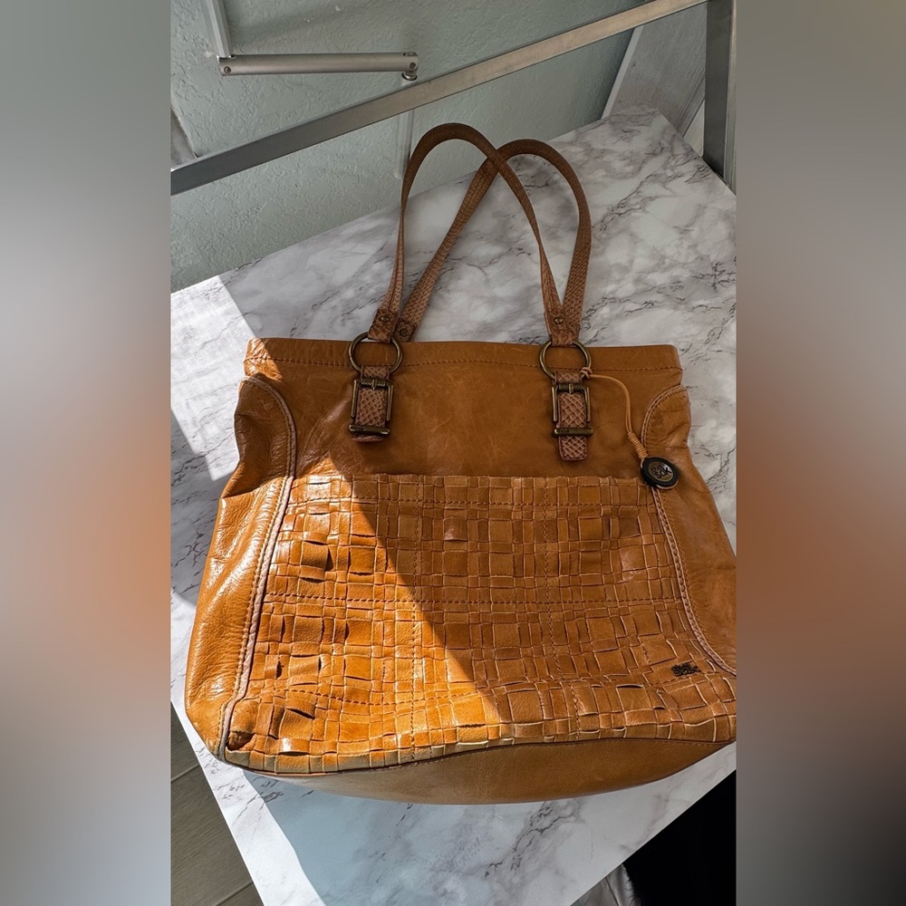 The Sak camel tan woven leather shoulder bag